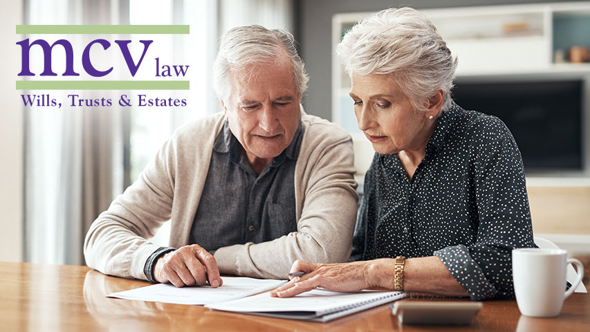 estate planning attorneys near syracuse ny from mcv law elderly couple going through wills, trust, and estate plans