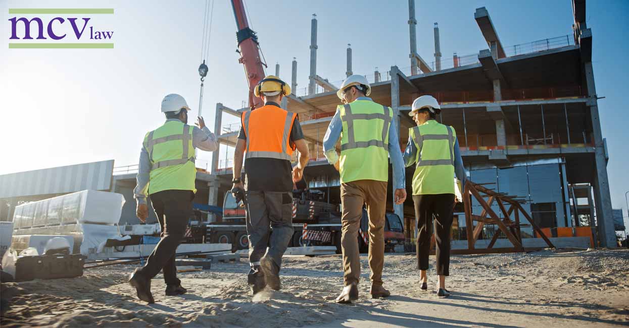 Construction workers walking towards a construction site