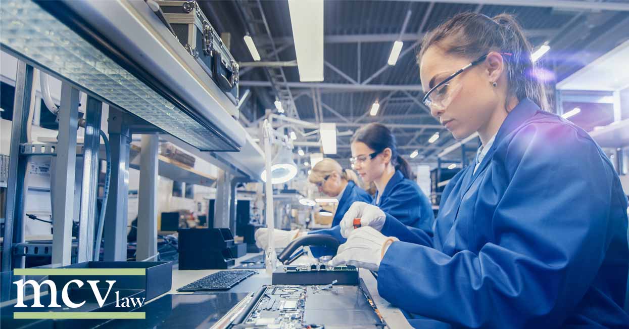 A woman working on a production line