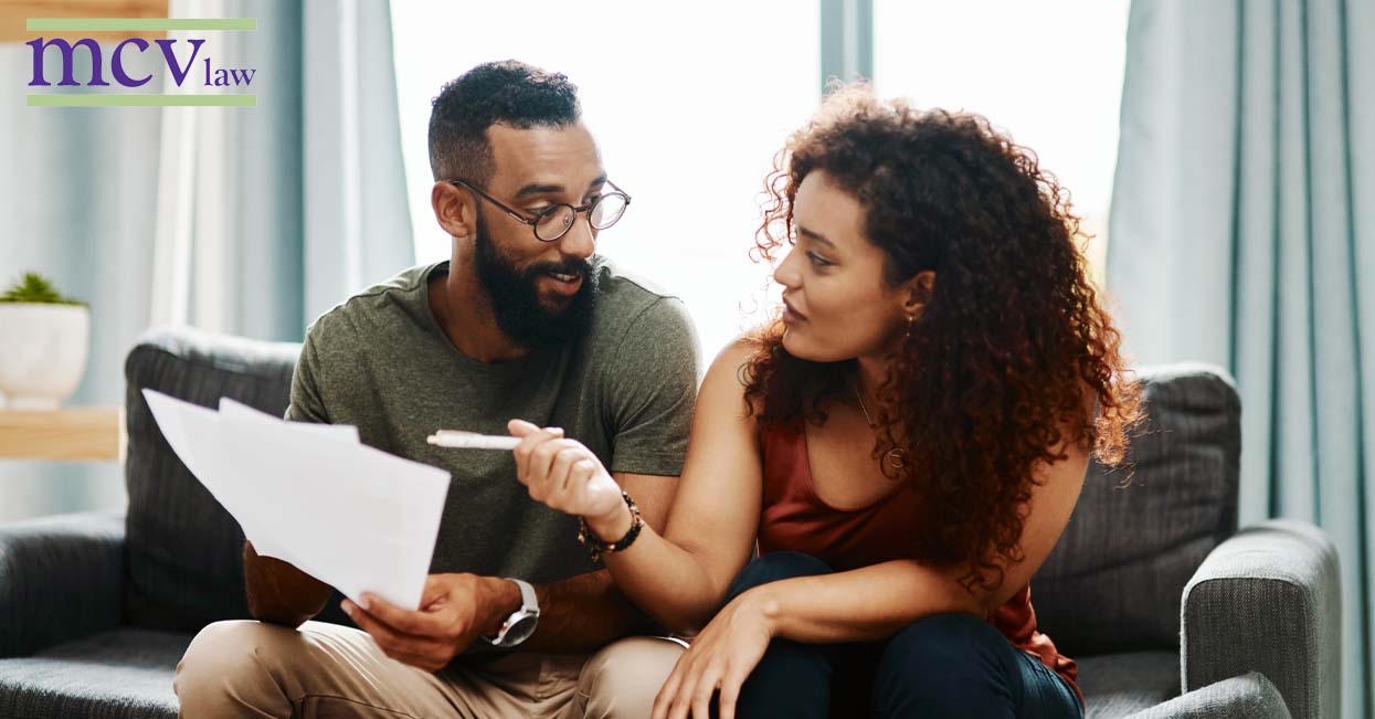 Couple reviewing wills and trusts paperwork