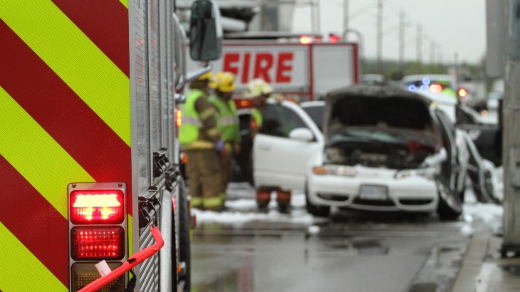 personal injury lawyers near watertown ny image of car accident with damaged car and first responders car accident lawyer