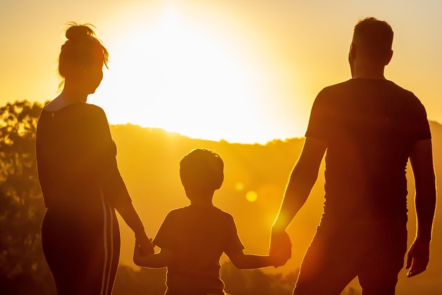 special needs trust near syracuse ny image of parents holding hands with child at sunset