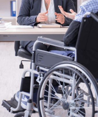 workers comp lawyers near oneida ny image of workers compensation attorney meeting with person in wheelchair