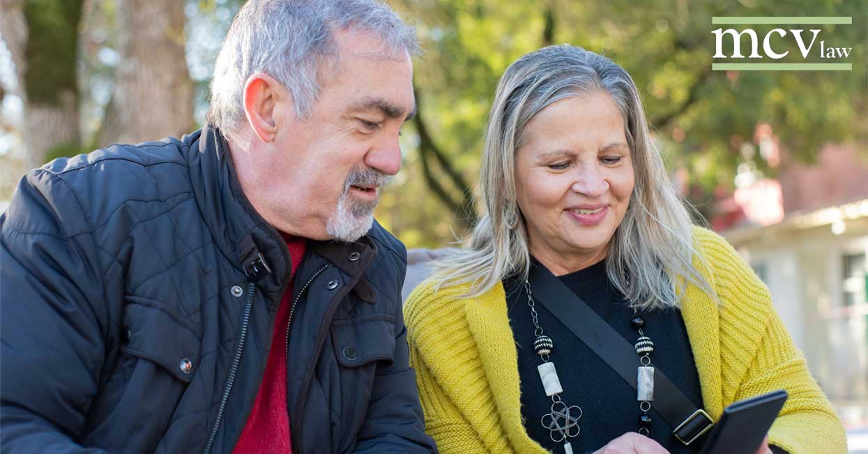 Older couple looking at a cell phone together