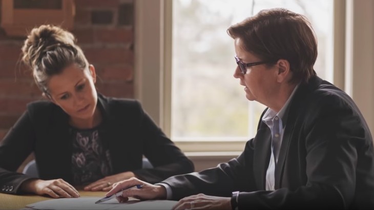 disability lawyers near syracuse ny image of attorneys meeting and discussing paperwork