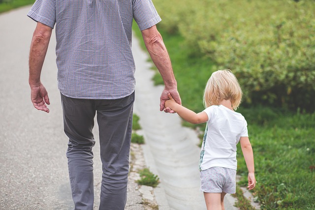 trust lawyers near syracuse ny grandpa holding hands with granddaughter