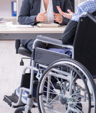 rochester disability attorneys woman in wheelchair meeting with social security disability lawyer